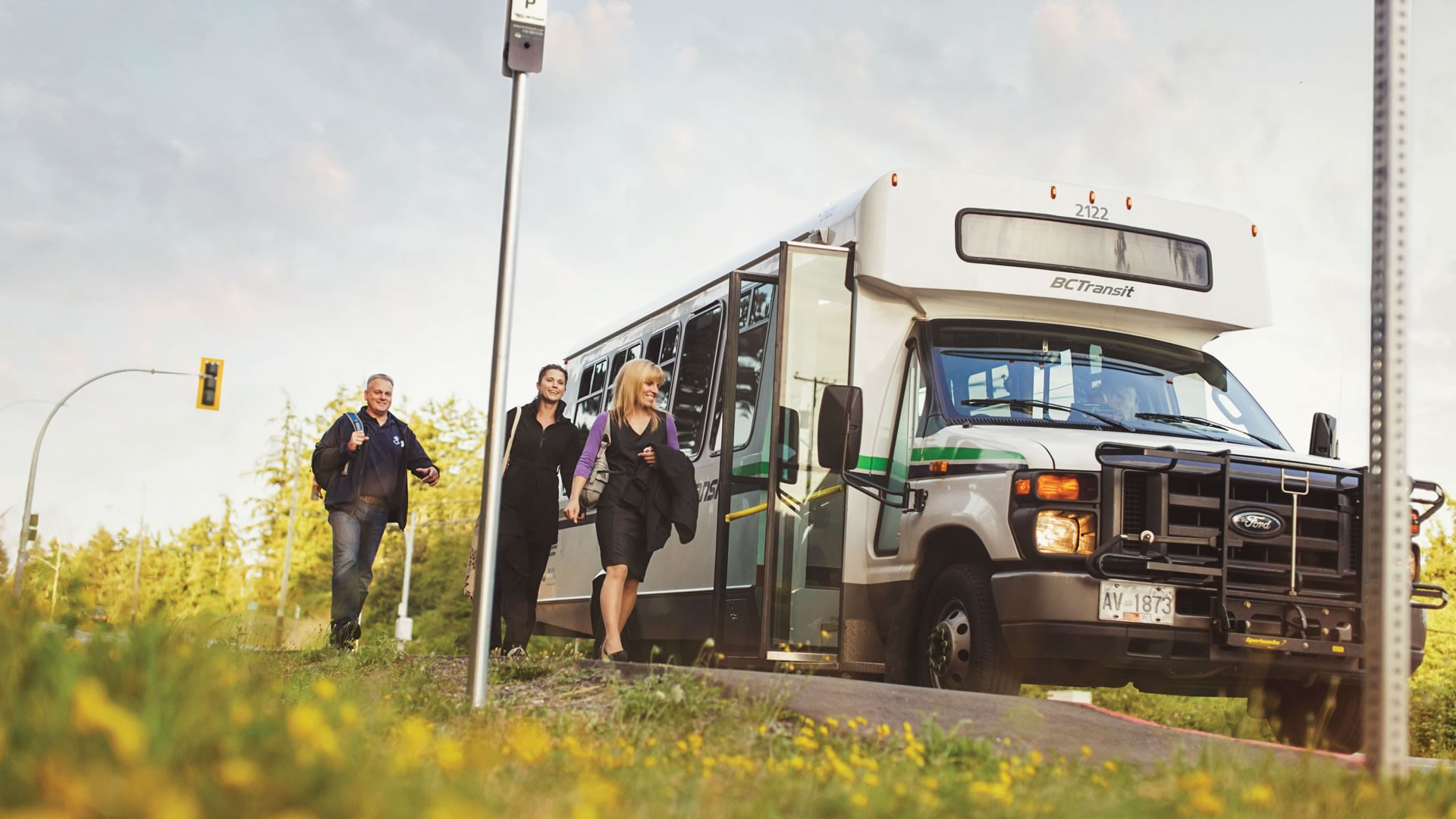 Passengers boarding a BC Transit intercommunity bus.