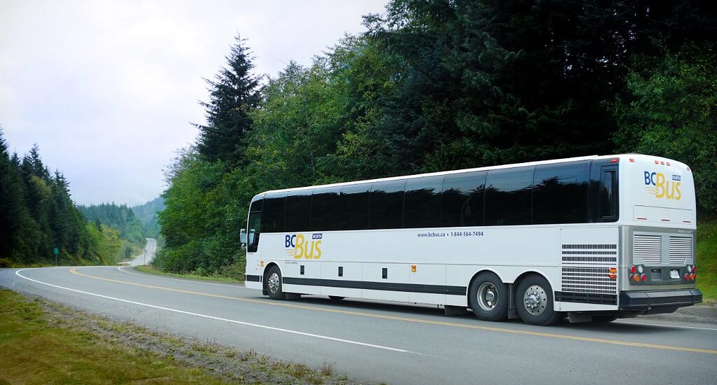 Motorcoach in BC Bus North livery travelling down Highway 16 in northern British Columbia. Photo credit: Government of British Columbia CC BY-NC-ND 2.0